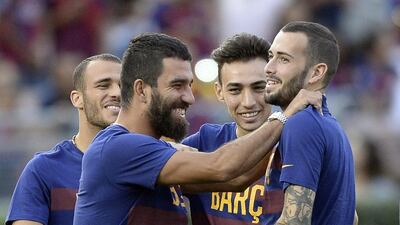 Arda Turan and Aleix Vidal, centre left and right, January will mark their first chance to play competitively for Barcelona. Kevork Djansezian / Getty Images