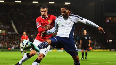 Joleon Lescott, right, of West Bromwich Albion clears the ball from Robin van Persie of Manchester United during their Premier League match at The Hawthorns on October 20, 2014, in West Bromwich, England. Laurence Griffiths / Getty Images