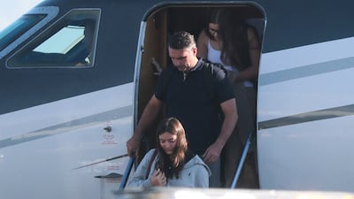 Brazilian presidential candidate Flavio Bolsonaro arrives at Miami-Opa Locka Executive Airport, in Florida, with his family on October 28. Getty Images via AFP