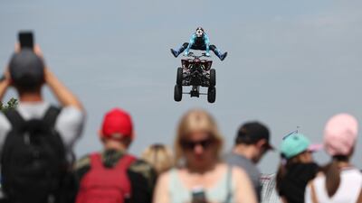 A motorcyclist performs during the Day of Moscow Sports Festival. The festival, organised by Moscow authorities, aims to promote a healthy lifestyle. EPA