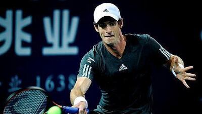 Andy Murray of Britain returns a shot against Lukas Lacko of Slovakia during their quarterfinal match at the Shenzhen Open tennis championship in Shenzhen, southern China's Guangdong province on September 26, 2014. Andy Murray beat Lukas Lacko 6-3 7-5. AFP PHOTO