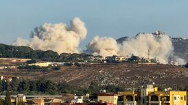 Smoke rises following Israeli controlled explosions in Kfar Tibnit, seen from Nabatieh in southern Lebanon. AFP