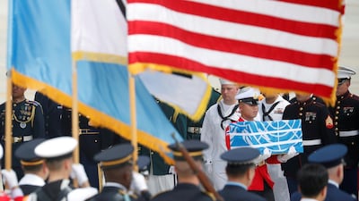 A soldier carries a casket containing the remains of a US soldier killed in the Korean War during a ceremony at Osan Air Base in Pyeongtaek, South Korea, on July 27, 2018. Reuters