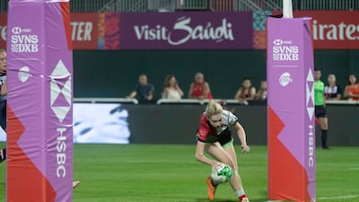 Abu Dhabi Harlequins touch down for a try against Dubai College.