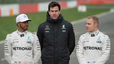 Mercedes-GP team boss Toto Wolff, centre, says they will continue to treat four-time Formula One champion Lewis Hamilton, left, and newly arrived Valtteri Bottas as equals and will not give one or the other preferential treatment, even if it is apparent Ferrari are doing just that with Sebastian Vettel. Oli Scarff / AFP