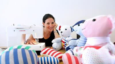 Catharine Steele with memory bears which she made out of baby sleep suits at her villa in Dubai. Pawan Singh / The National