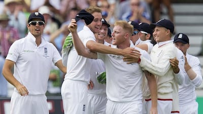 England’s Stuart Broad, second left, celebrates with teammates after taking the wicket of Australia’s Steven Smith, caught by Ben Stokes, centre, for 5 on Day 2 of the fourth Ashes Test at Trent Bridge cricket ground in Nottingham, England, Friday, August 7, 2015. Jon Super / AP Photo