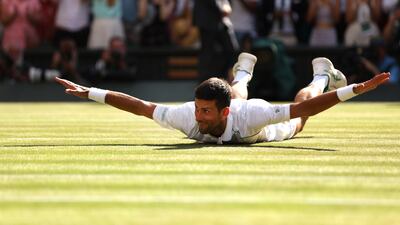 Novak Djokovic celebrates after winning match point at the All England Club. Getty