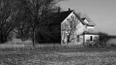 An abandoned farmhouse on the Iowa prairie. Robinson's fiction is set in an isolated and remote America. iStock