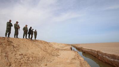 The construction of berms and water-filled trenches, according to Tunisia’s defence minister Farhat Horchani, marks an important day in country’s fight against terrorism, which has claimed dozens of lives last year. Zoubeir Souissi / Reuters