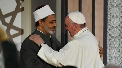 Pope Francis and Sheikh Ahmed Al Tayeb, the Grand Imam of Al Azhar, embrace as the Pope arrives at the prestigious Sunni institution in Cairo in April 2017. Andreas Solaro / AFP