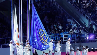 Guards prepare to hoist flags during the 31st Southeast Asian Games opening ceremony at the My Dinh National Stadium in Hanoi, Vietnam. EPA