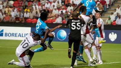 Andre Senghor, of Baniyas , attempts to head the ball against Al Jazira.