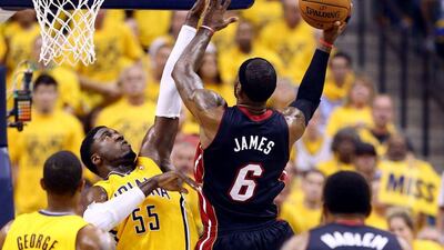 LeBron James of the Miami Heat goes to the basket against Roy Hibbert of the Indiana Pacers during Game 2 of their Eastern Conference finals series on Tuesday night. Andy Lyons / Getty Images / AFP / May 20, 2014
