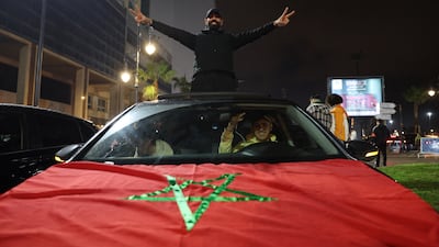 Morocco fans celebrate on the streets after winning their semi-final against Nigeria in Rabat. Reuters