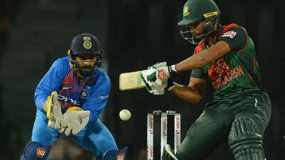 Dinesh Karthik, left, has said India must be at their best to beat Bangladesh in the tri-series final. Lakruwan Wanniarachchi / AFP