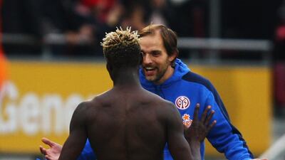 Head coach Thomas Tuchel of Mainz celebrates with his player Aristide Bance on October 24, 2009. Getty Images