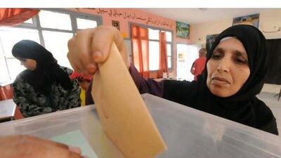 Moroccans post their ballots at a voting station in Sale on Friday.