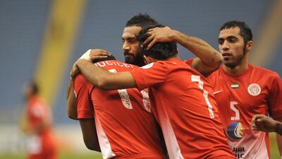 Al Jazira players celebrate after scoring their third goal against Saudi Arabia's Al Shabab during their Asian Champions League Group A match at King Fahad International Stadium in Riyadh on March 11, 2014. Fayez Nureldine / AFP