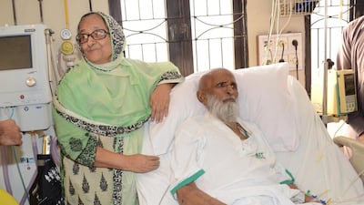 Bilqees Edhi, stands next to her husband and Pakistan's renowned social worker Abdul Sattar Edhi at a hospital in Karachi, Pakistan last month. Abdul Sattar Edhi, who devoted his life to the poor and the destitute, died on Friday at a hospital in Karachi following a prolonged illness. He was 88. (AP Photo/Shakil Adil)
