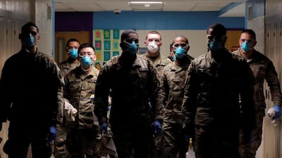 Members of Joint Task Force 2, composed of soldiers and airmen from the New York Army and Air National Guard, work to sanitize the New Rochelle High School during the coronavirus disease (COVID-19) outbreak in New Rochelle, New York, U.S. REUTERS
