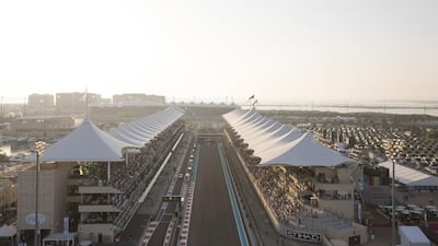 An Etihad Airlines passenger jet flies over the start/finish line before the beginning of the 2014 Formula 1 Etihad Airways Abu Dhabi Grand Prix. Donald Weber / Crown Prince Court — Abu Dhabi