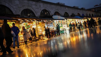 People buy food outside a market at Eminonu commercial area in Istanbul. Turkey raised fuel taxes by 6 per cent to address its widening fiscal deficit and stabilise the country's finances without affecting the 2025 inflation goal. AP