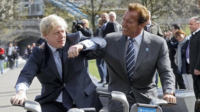 Former California Governor, Arnold Schwarzenegger (R), and London Mayor Boris Johnson pose for photographers, in London March 31, 2011. REUTERS/Stefan Wermuth (BRITAIN - Tags: ENTERTAINMENT POLITICS)