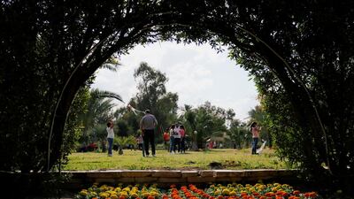 Iraqi families are seen during the International Flowers Festival at al-Zawra park in Baghdad. Reuters
