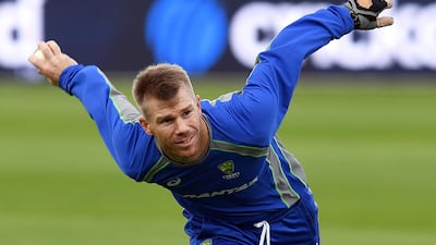 David Warner and his fellow Australia cricketers are holding out for what they term a fair share of the revenue earned by Cricket Australia. Paul Ellis / AFP