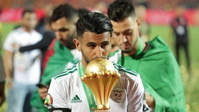 Algeria's Riyad Mahrez kisses the trophy after winning the 2019 African Cup of Nations final in Cairo. AP
