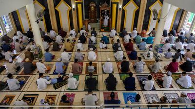 Indonesian Muslim men take part in prayers at a mosque in Palu, Central Sulawesi Province, Indonesia. Reuters