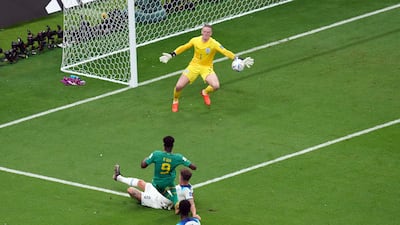 England goalkeeper Jordan Pickford saves from Senegal's Boulaye Dia. PA