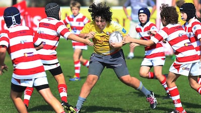 The Heartbeat Sports Tigers surround a Hurricanes 1 player to trap the offender during game action on Friday, January 22, 2016, at the HSBC Rugby Festival Dubai. DELORES JOHNSON / The National