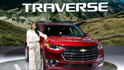 A model poses next to the Chevrolet Traverse at the show. EPA