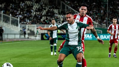 George Baldock, front, in what turned out to be his final match for Greek club Panathinaikos in the Athens derby against Olympiacos on October 6, 2024. EPA