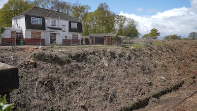 Vegetation and trees have been removed, and empty homes such as this one that was bought under compulsory purchase, lie empty having made way for HS2 tracks. Getty Images