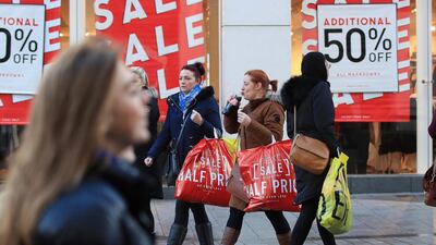 Shoppers take advantage of the Boxing Day sales in Liverpool city centre. Peter Byrne/PA via AP