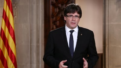 Catalan Regional President Carles Puigdemont gestures made a statement in Barcelona. Catalan Government/Jordi Bedmar via Reuters