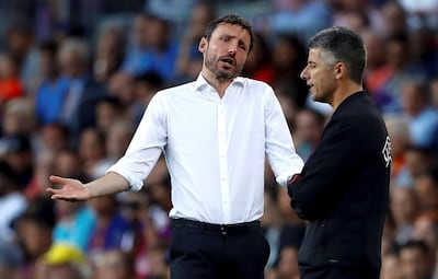 PSV Eindhoven manager Mark van Bommel, left, said there was no shame in losing to Barcelona at Camp Nou. EPA