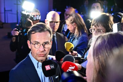 Sweden's Prime Minister Ulf Kristersson, leader of the conservative Moderates, speaks to the press on election night in Stockholm. AFP