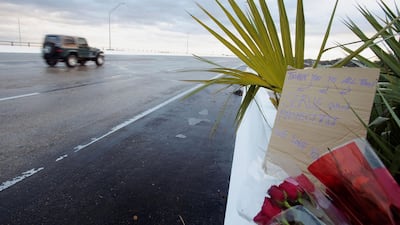 Flowers and a message are left on the entrance bridge after a member of the Saudi Air Force visiting the United States for military training was the suspect in a shooting at Naval Air Station Pensacola, in Pensacola, Florida, US December 6, 2019. Reuters