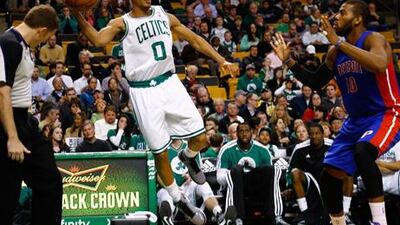 Boston's Avery Bradley stops the ball from leaving play against Detroit's Greg Monroe.