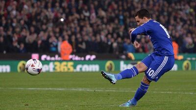 Chelsea’s Eden Hazard shoots from the penalty spot during the shoot-out on Tuesday night against Stoke. He shot was stopped by Stoke’s Jack Butland. Oli Scarff / AFP