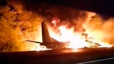 An AN-26 military plane bursts into flames after it crashed in the town of Chuguyiv close to Kharkiv, Ukraine. Emergency Situation Ministry via AP