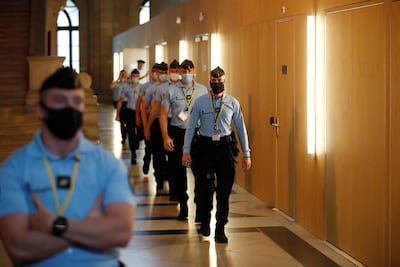French gendarmes walk past the temporary courtroom on the second day of the trial of the Paris' November 2015 attacks. Reuters