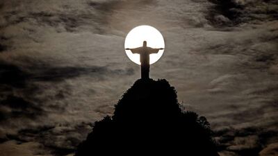 Sunset behind Christ the Redeemer and Corcovado hill in Rio de Janeiro, Brazil Marcelo Sayao / EPA