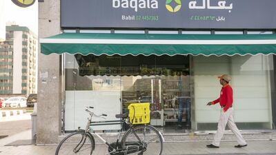 Shoppers enjoy the convenience of Abu Dhabi's Baqalas. Mona Al Marzooqi / The National