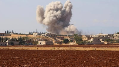 Smoke rises from an alleged Syrian government airstrike in Hobeit village near Idlib. AP