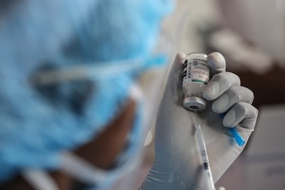 A health worker holds a vial of the Covishield Covid-19 vaccine at a temporary vaccine centre in Colombo, Sri Lanka.